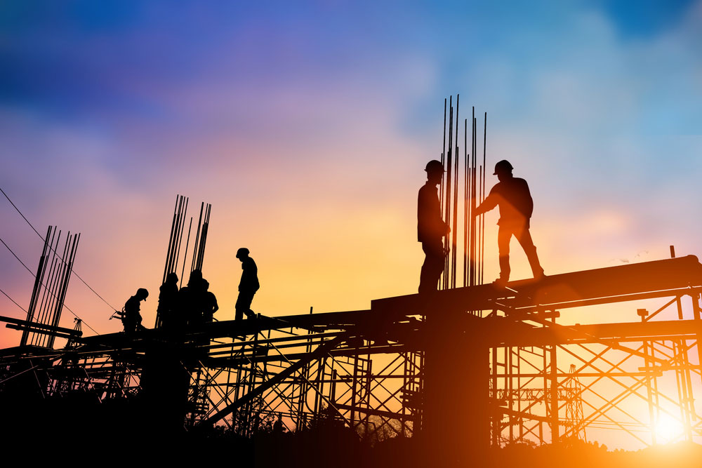 Silhouette of engineers on construction site